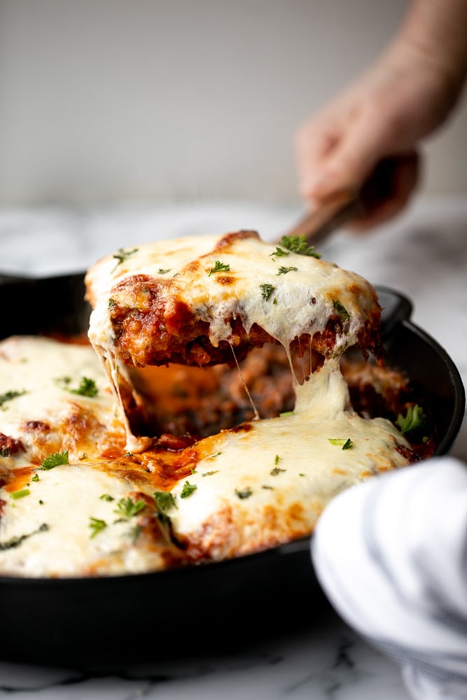 Baked turkey parmesan with a delicious, crispy, breaded coating covered in a rich homemade tomato sauce and topped with melted mozzarella and parmesan. | aheadofthyme.com