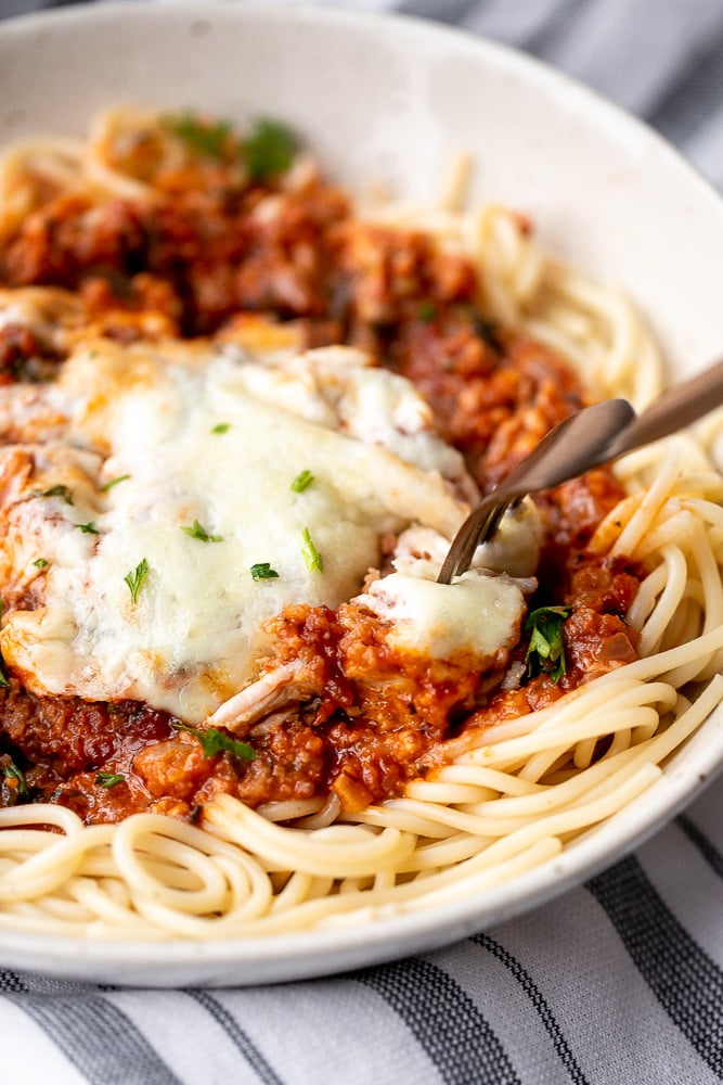 Baked turkey parmesan with a delicious, crispy, breaded coating covered in a rich homemade tomato sauce and topped with melted mozzarella and parmesan. | aheadofthyme.com