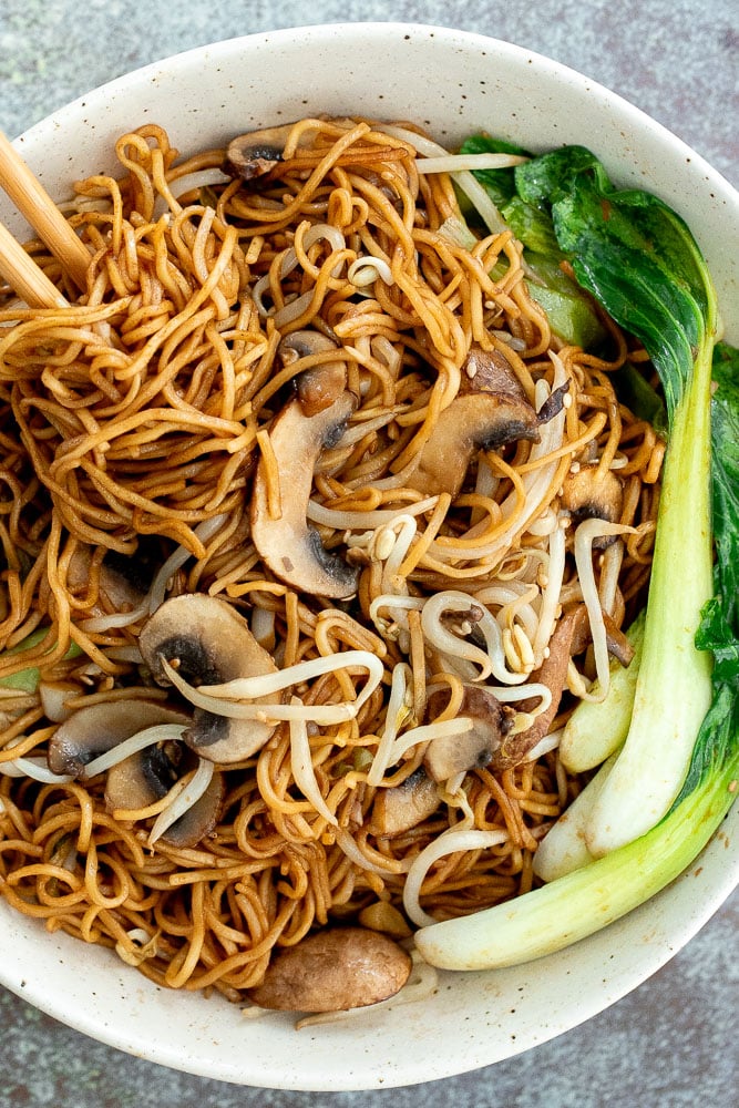 Better than takeout, quick easy stir-fried vegetarian chow mein is packed with vegetables and coated in a delicious savoury sauce. Make it in 15 minutes. | aheadofthyme.com