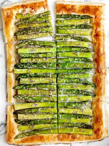 Asparagus tart with Gruyère cheese, a balsamic glaze, and flaky puff pastry, is a flavourful and delicious addition to brunch this spring season. | aheadofthyme.com