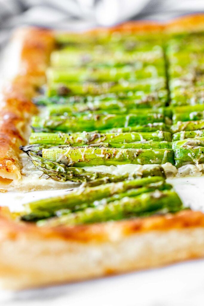 Asparagus tart with Gruyère cheese, a balsamic glaze, and flaky puff pastry, is a flavourful and delicious addition to brunch this spring season. | aheadofthyme.com