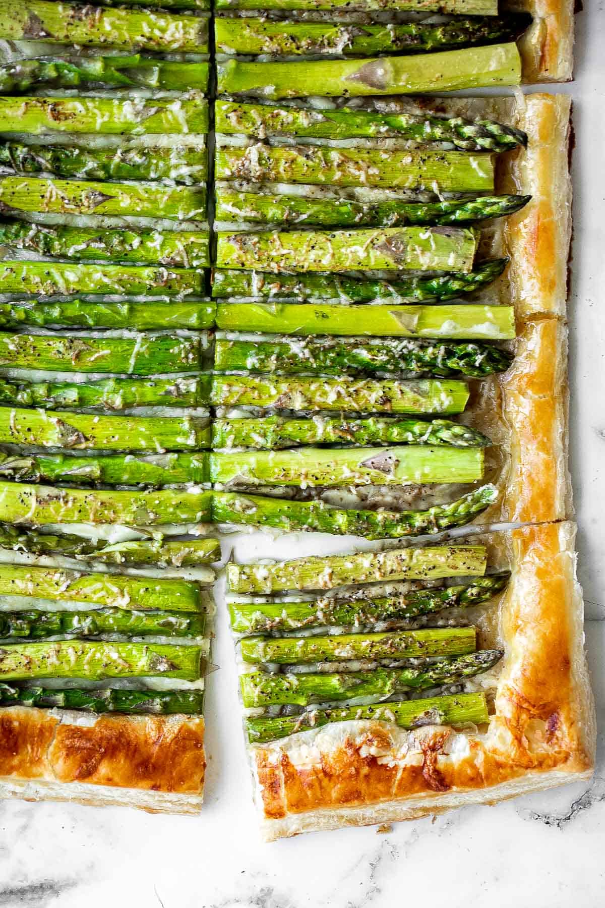 Asparagus tart with Gruyère cheese, a balsamic glaze, and flaky puff pastry, is a flavourful and delicious addition to brunch this spring season. | aheadofthyme.com