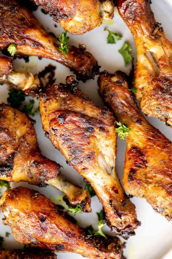 Baked curried chicken drumsticks are an easy to make dinner with quick prep and minimal dishes. They're tender, delicious, and packed with flavour. | aheadofthyme.com