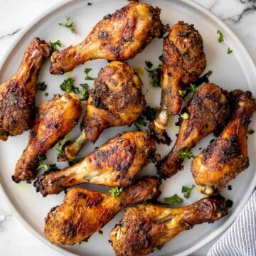 Baked curried chicken drumsticks are an easy to make dinner with quick prep and minimal dishes. They're tender, delicious, and packed with flavour. | aheadofthyme.com