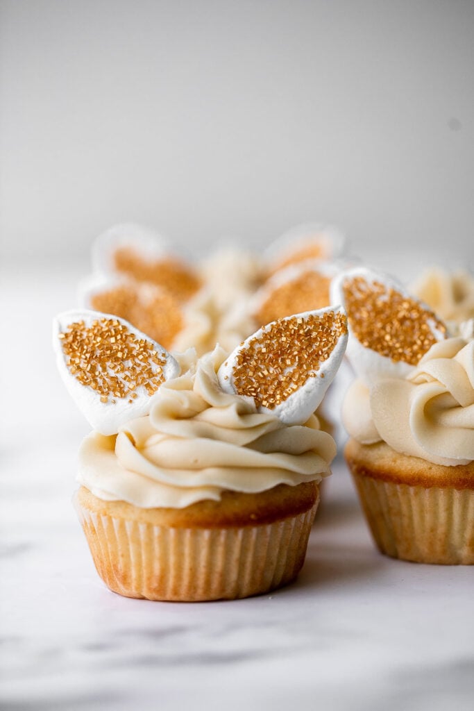 Get festive with these cute bunny ears Easter cupcakes. Buttercream frosting and marshmallows make these vanilla cupcakes extra sweet and delicious. | aheadofthyme.com