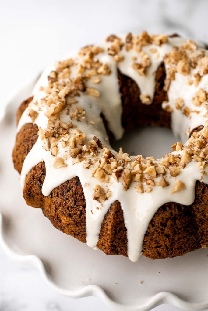 Showstopping carrot bundt cake with cream cheese glaze is light, fluffy, and moist. It's loaded with sugar, spice, and everything nice. | aheadofthyme.com