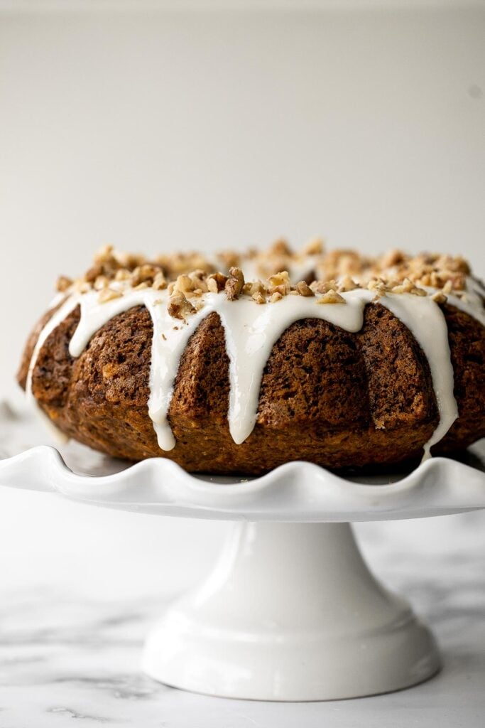 Showstopping carrot bundt cake with cream cheese glaze is light, fluffy, and moist. It's loaded with sugar, spice, and everything nice. | aheadofthyme.com