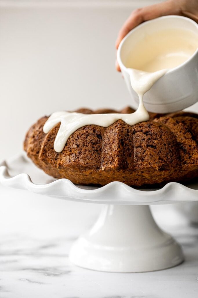 Showstopping carrot bundt cake with cream cheese glaze is light, fluffy, and moist. It's loaded with sugar, spice, and everything nice. | aheadofthyme.com