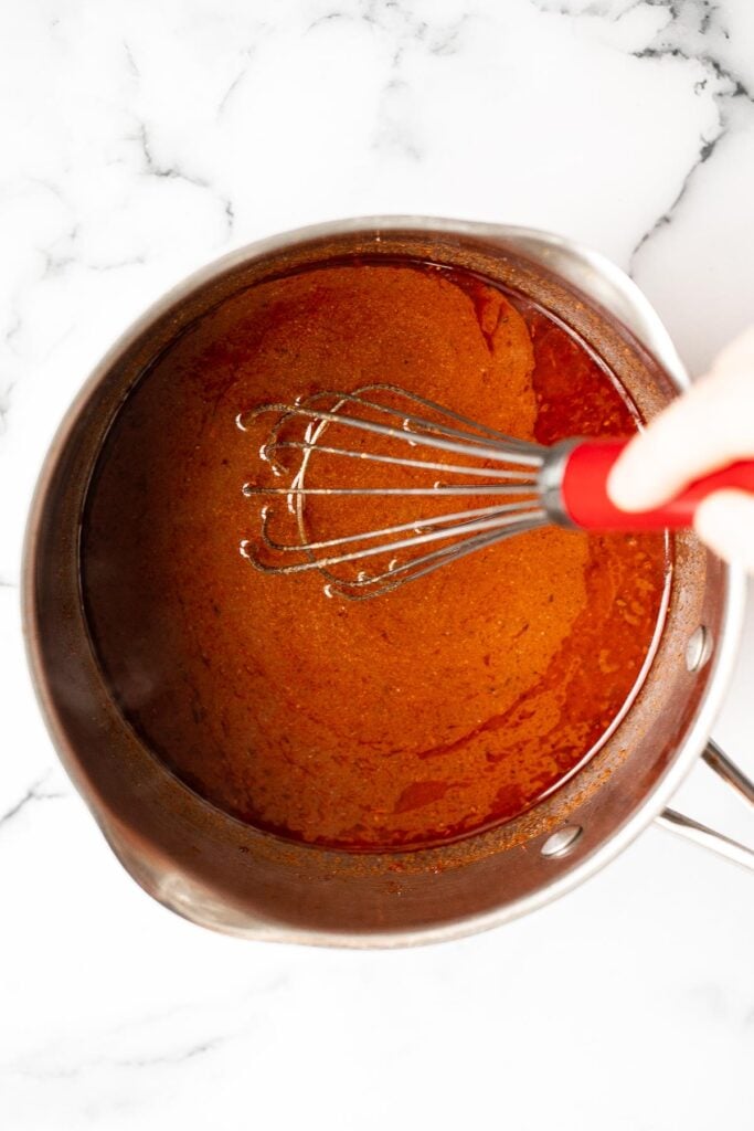 Easy homemade enchilada sauce requires just one pot, an assortment of flavourful spices, four simple steps, and less than 15 minutes to make. | aheadofthyme.com