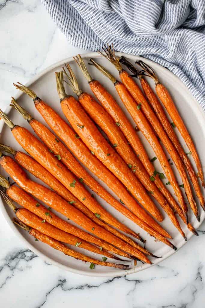 Honey roasted carrots are a sweet, savoury, and salty side dish that pairs well with almost any entree. With these flavours, everyone will want seconds. | aheadofthyme.com