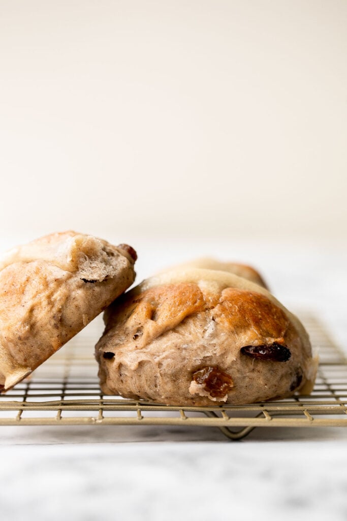 Hot cross buns is a timeless classic Easter bread made with raisins, cinnamon, and a honey glaze. They are perfect for breakfast, a snack or dessert. | aheadofthyme.com