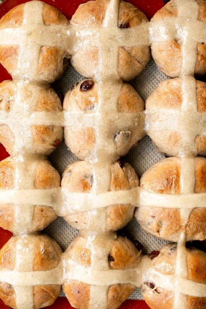 Hot cross buns is a timeless classic Easter bread made with raisins, cinnamon, and a honey glaze. They are perfect for breakfast, a snack or dessert. | aheadofthyme.com