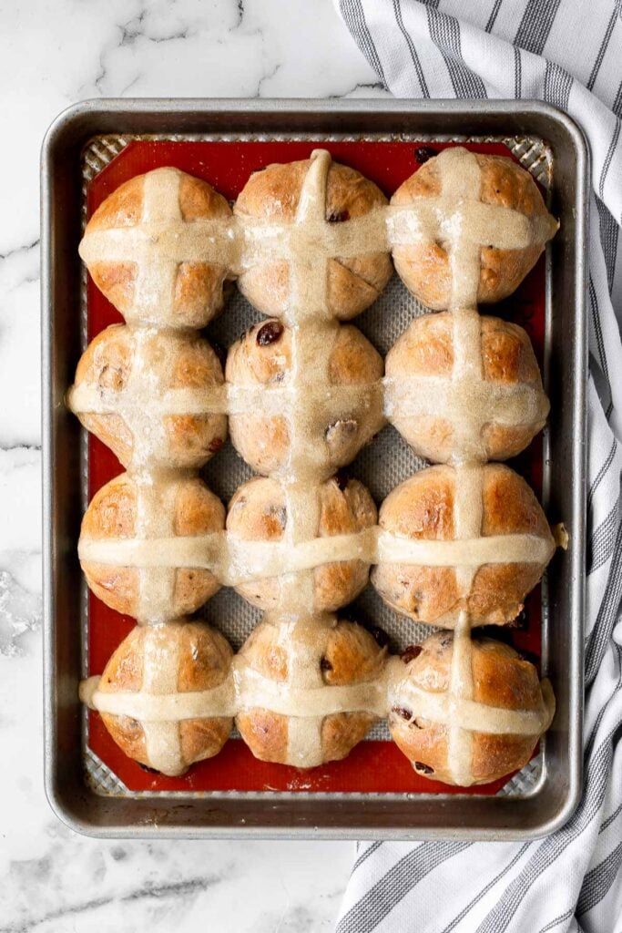 Hot cross buns is a timeless classic Easter bread made with raisins, cinnamon, and a honey glaze. They are perfect for breakfast, a snack or dessert. | aheadofthyme.com