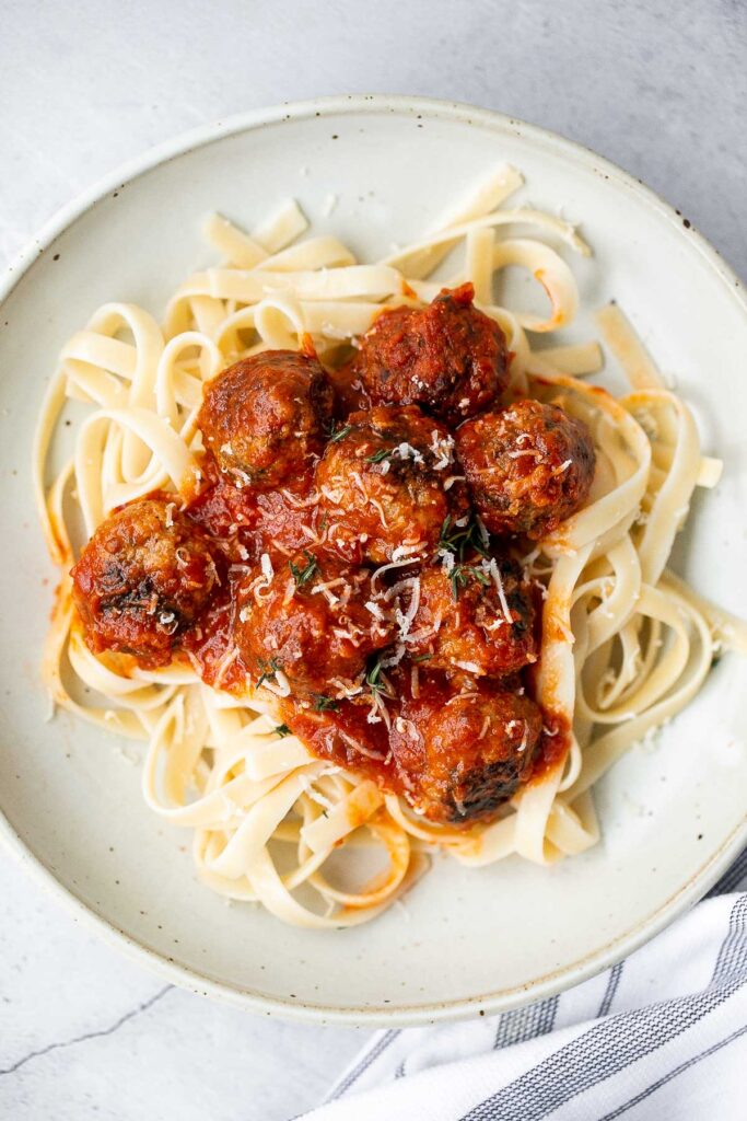 Quick, easy homemade Italian meatballs are juicy, flavourful, and delicious, simmered in a rich and savoury tomato sauce. Make them in just 30 minutes. | aheadofthyme.com