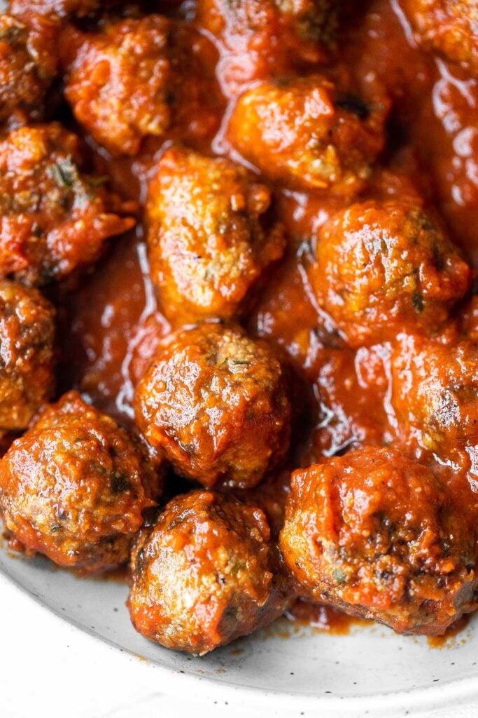 Quick, easy homemade Italian meatballs are juicy, flavourful, and delicious, simmered in a rich and savoury tomato sauce. Make them in just 30 minutes. | aheadofthyme.com