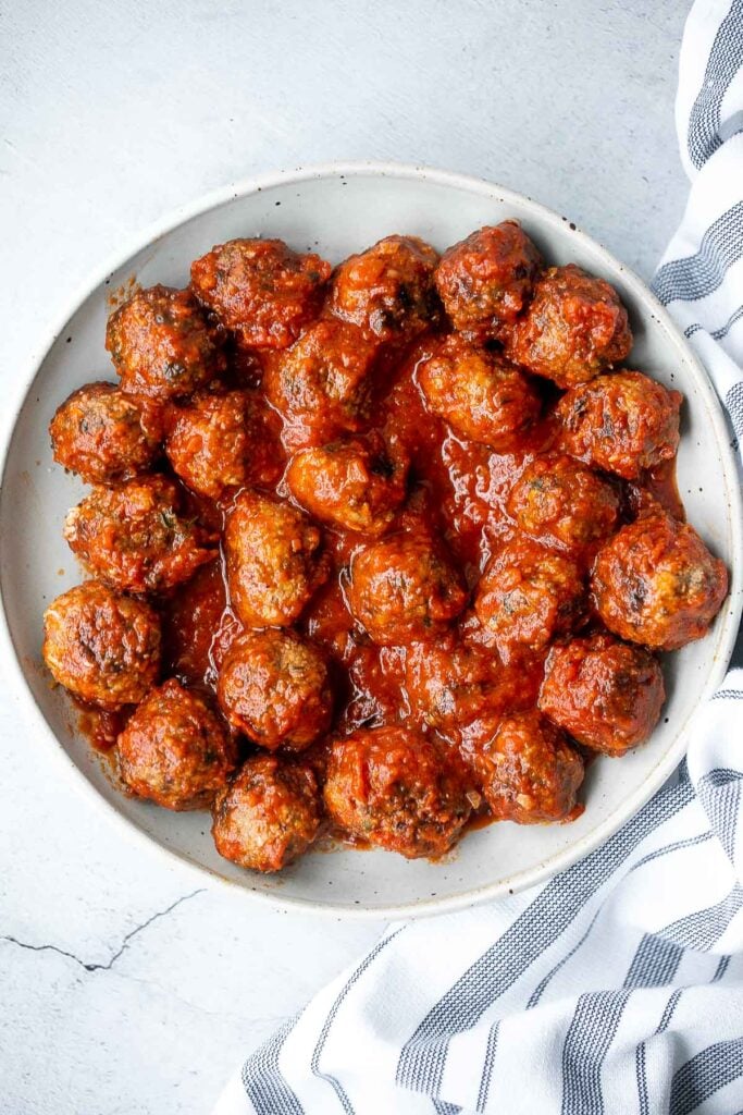 Quick, easy homemade Italian meatballs are juicy, flavourful, and delicious, simmered in a rich and savoury tomato sauce. Make them in just 30 minutes. | aheadofthyme.com