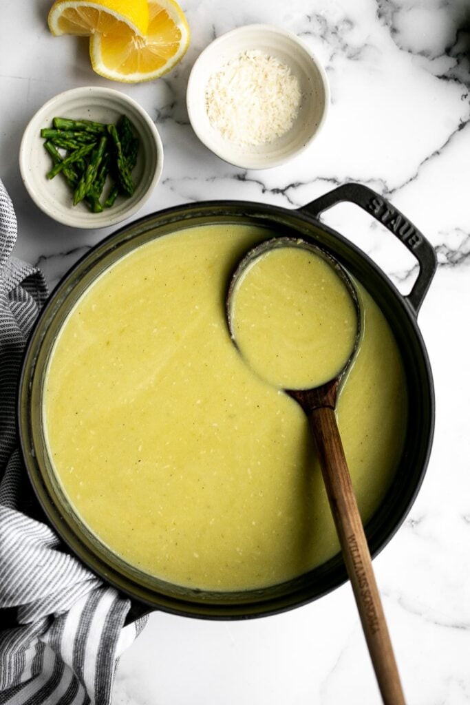 Lemon asparagus soup with parmesan is the perfect spring soup -- smooth, light, fresh, and flavourful. It's customizable and can be served hot or cold. | aheadofthyme.com