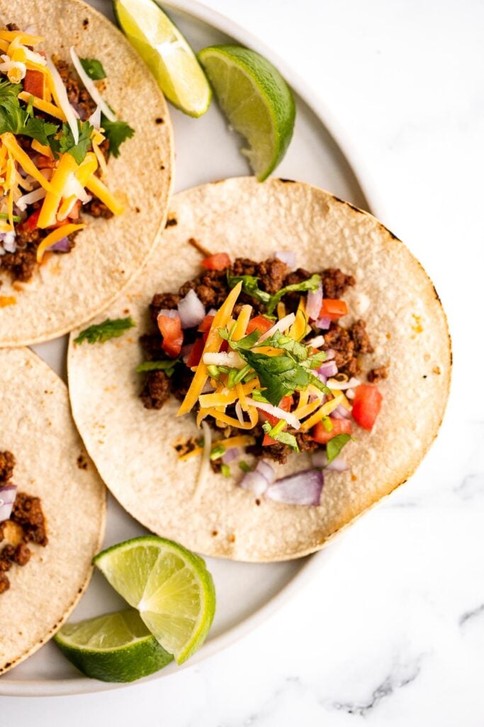 Ground beef tacos are delicious, authentic, and so easy to make. They're savory, spicy, creamy, and fresh. The perfect recipe for a Mexican fiesta. | aheadofthyme.com