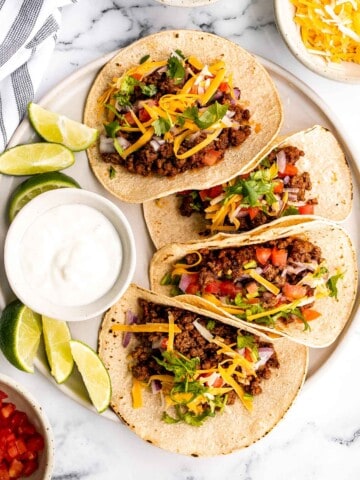 Ground beef tacos are delicious, authentic, and so easy to make. They're savory, spicy, creamy, and fresh. The perfect recipe for a Mexican fiesta. | aheadofthyme.com