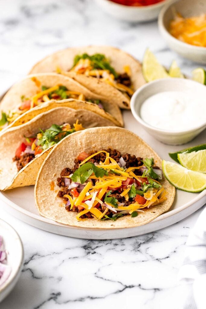 Ground beef tacos are delicious, authentic, and so easy to make. They're savory, spicy, creamy, and fresh. The perfect recipe for a Mexican fiesta. | aheadofthyme.com