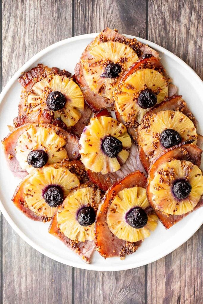 Sweet and savoury pineapple glazed ham slices are perfect for a holiday dinner. With a caramelized glaze, this ham is dressed to impress. | aheadofthyme.com