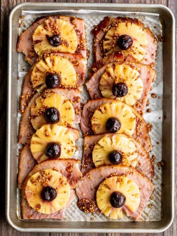 Sweet and savoury pineapple glazed ham slices are perfect for a holiday dinner. With a caramelized glaze, this ham is dressed to impress. | aheadofthyme.com