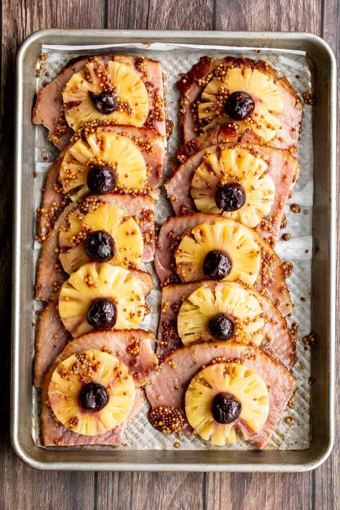 Sweet and savoury pineapple glazed ham slices are perfect for a holiday dinner. With a caramelized glaze, this ham is dressed to impress. | aheadofthyme.com