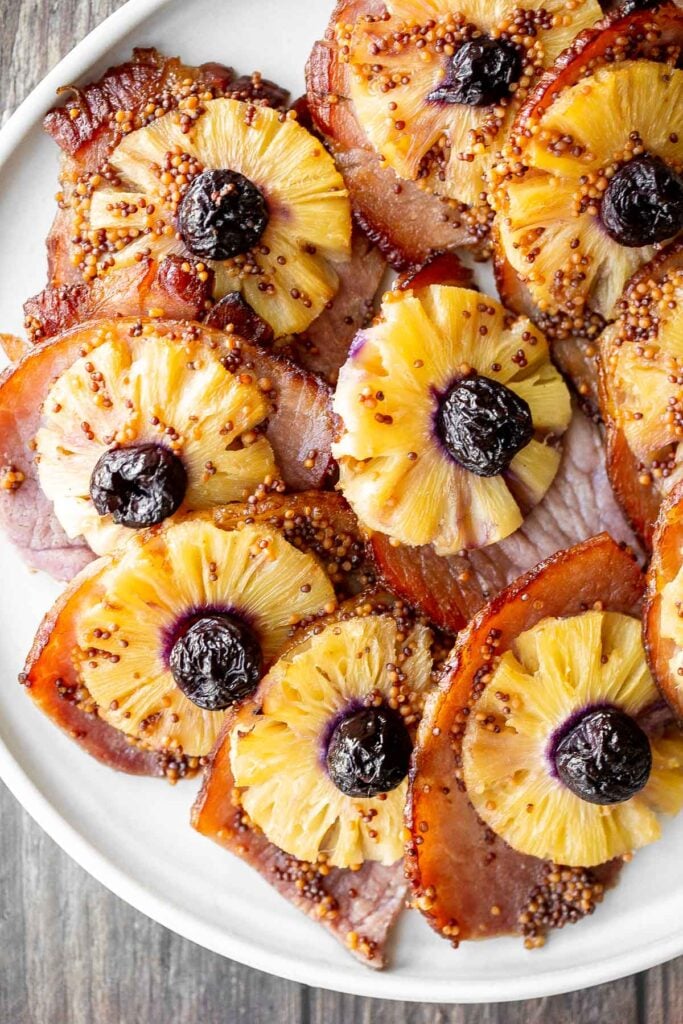 Sweet and savoury pineapple glazed ham slices are perfect for a holiday dinner. With a caramelized glaze, this ham is dressed to impress. | aheadofthyme.com