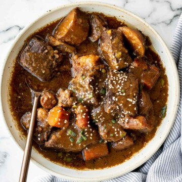 Slow cooker Korean short ribs deliver complex Asian flavours with little effort. Simply add your ingredients in the crockpot and let it cook dinner for you. | aheadofthyme.com
