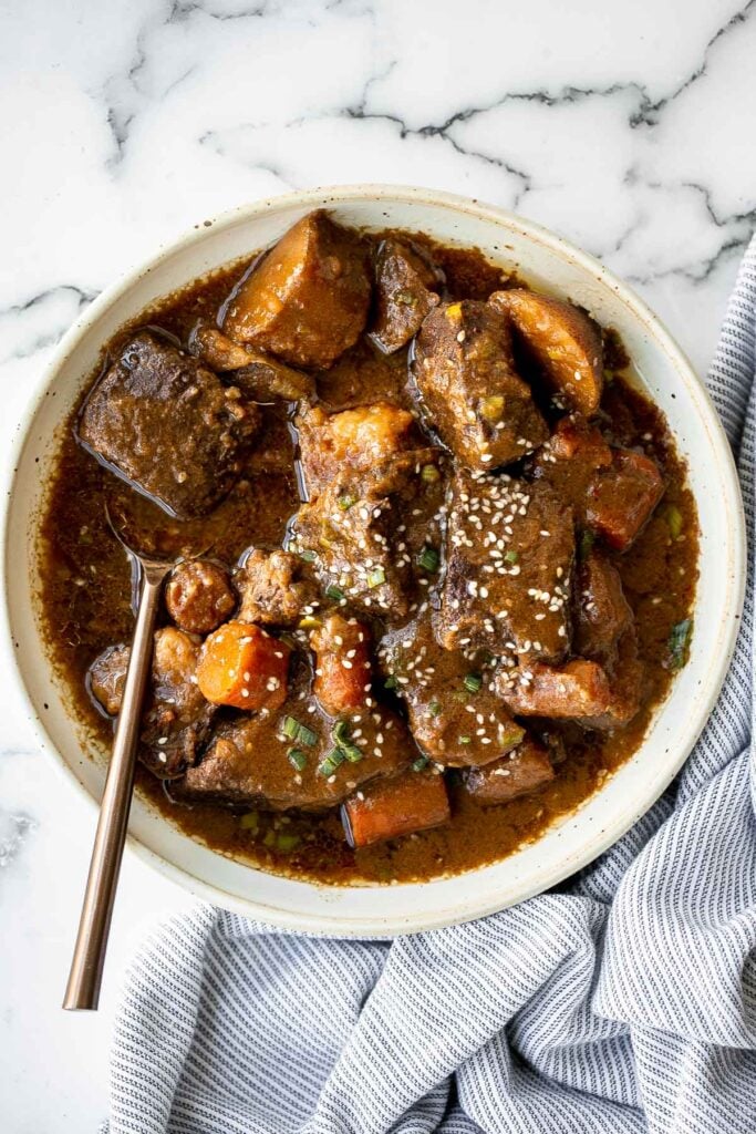 Slow cooker Korean short ribs deliver complex Asian flavours with little effort. Simply add your ingredients in the crockpot and let it cook dinner for you. | aheadofthyme.com