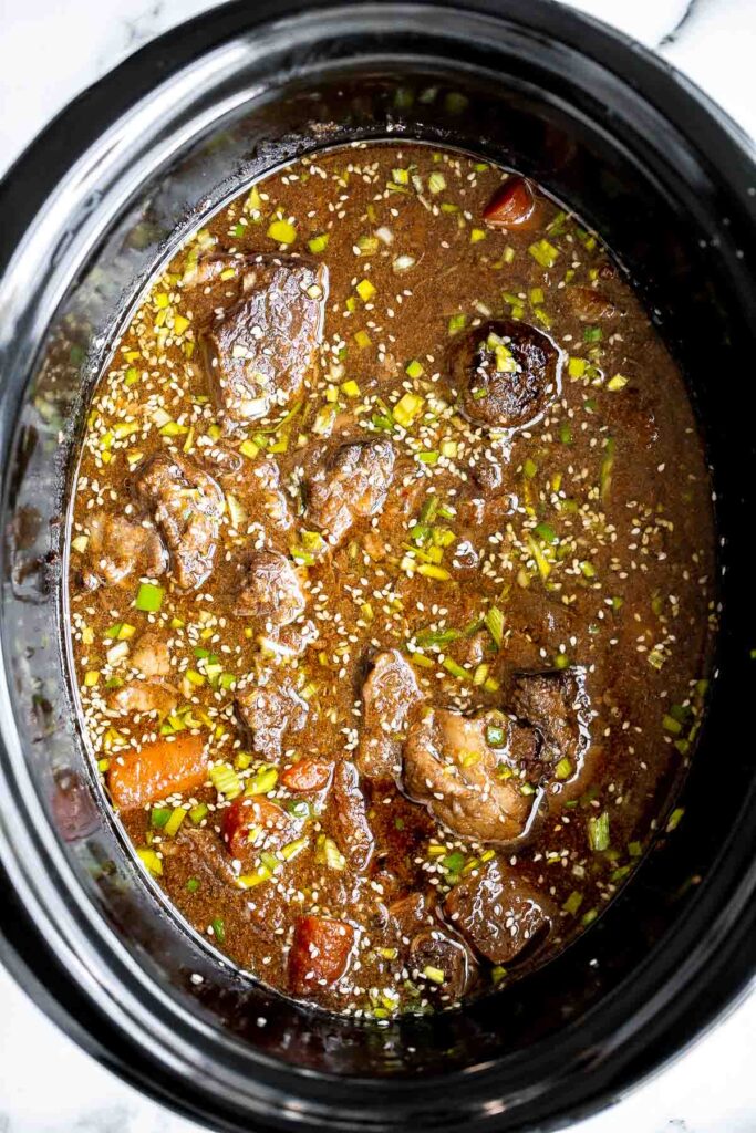 Slow cooker Korean short ribs deliver complex Asian flavours with little effort. Simply add your ingredients in the crockpot and let it cook dinner for you. | aheadofthyme.com