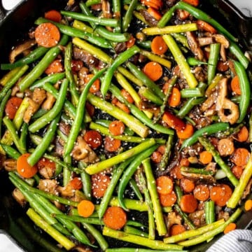 Quick and easy spring vegetable stir fry is made with delicious seasonal vegetables, packed with savoury and salty flavour, and takes 10 minutes to cook. | aheadofthyme.com