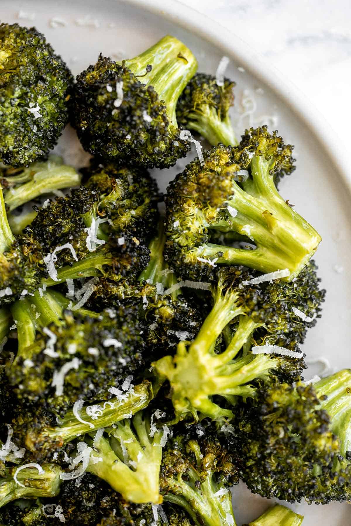 Quick and easy air fryer broccoli is a healthy side dish that takes just six minutes to cook in the air fryer. It's crispy, delicious, and flavorful. | aheadofthyme.com
