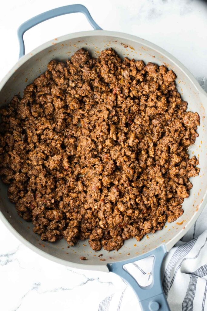 Beef taco salad is a simple, filling, and delicious meal loaded with your favorite taco fillings, and a creamy lime dressing. Make it in 20 minutes. | aheadofthyme.com