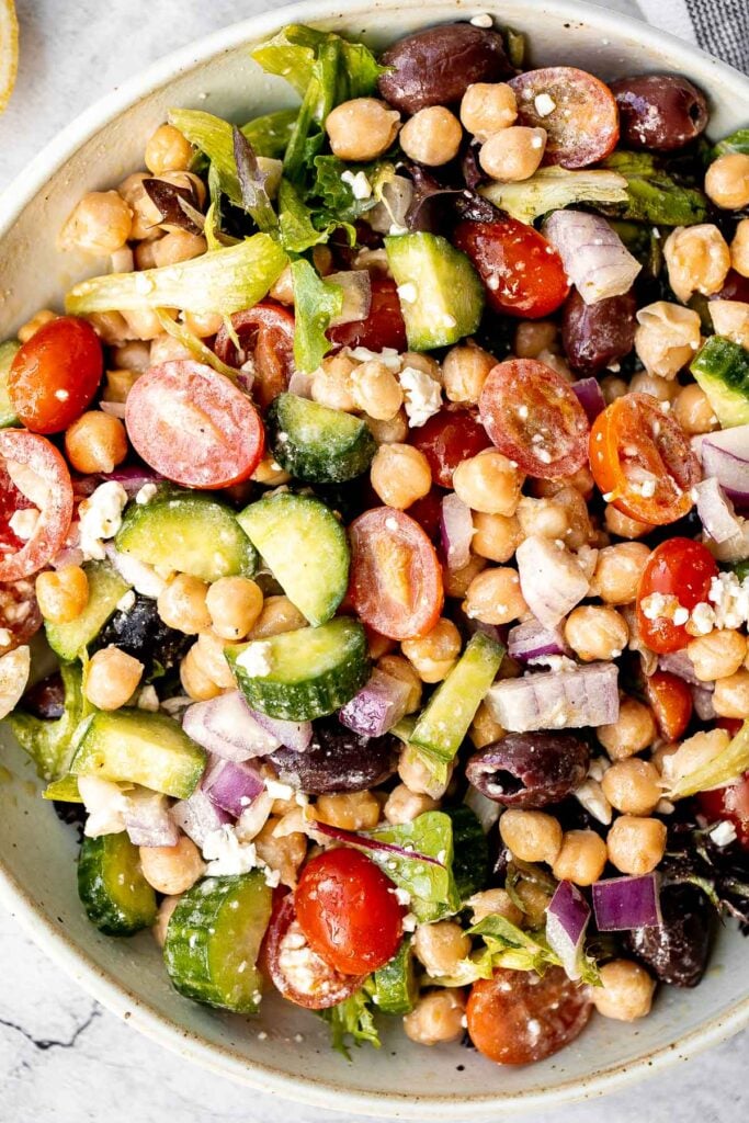 Chickpea Greek salad is a fresh, healthy, vibrant, and colorful salad, packed with traditional Mediterranean ingredients, superfoods, and nutrients. | aheadofthyme.com