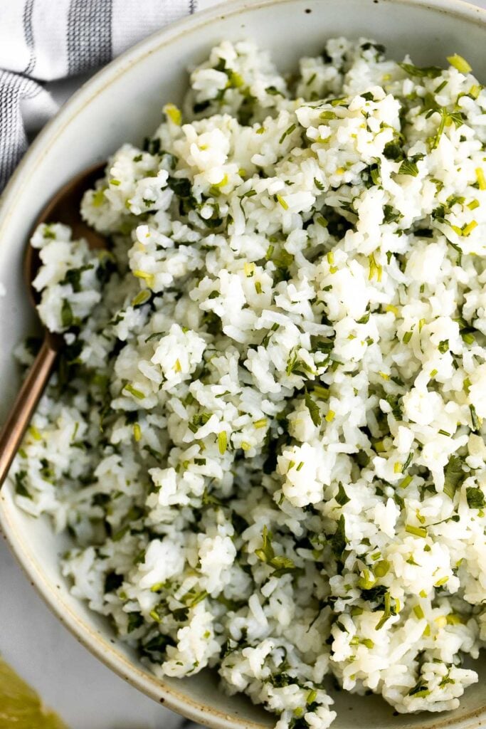 Cilantro lime rice is a fresh, bright and vibrant side dish that will add extra flavour to any meal you serve it with. It's a quick, easy, one pot recipe. | aheadofthyme.com