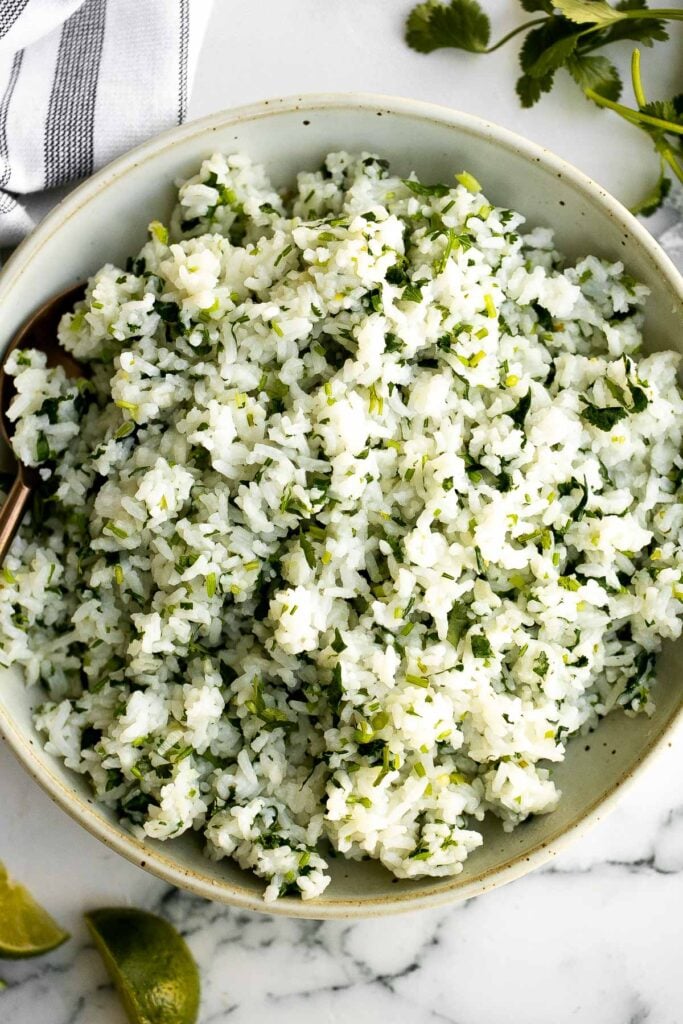 Cilantro lime rice is a fresh, bright and vibrant side dish that will add extra flavour to any meal you serve it with. It's a quick, easy, one pot recipe. | aheadofthyme.com