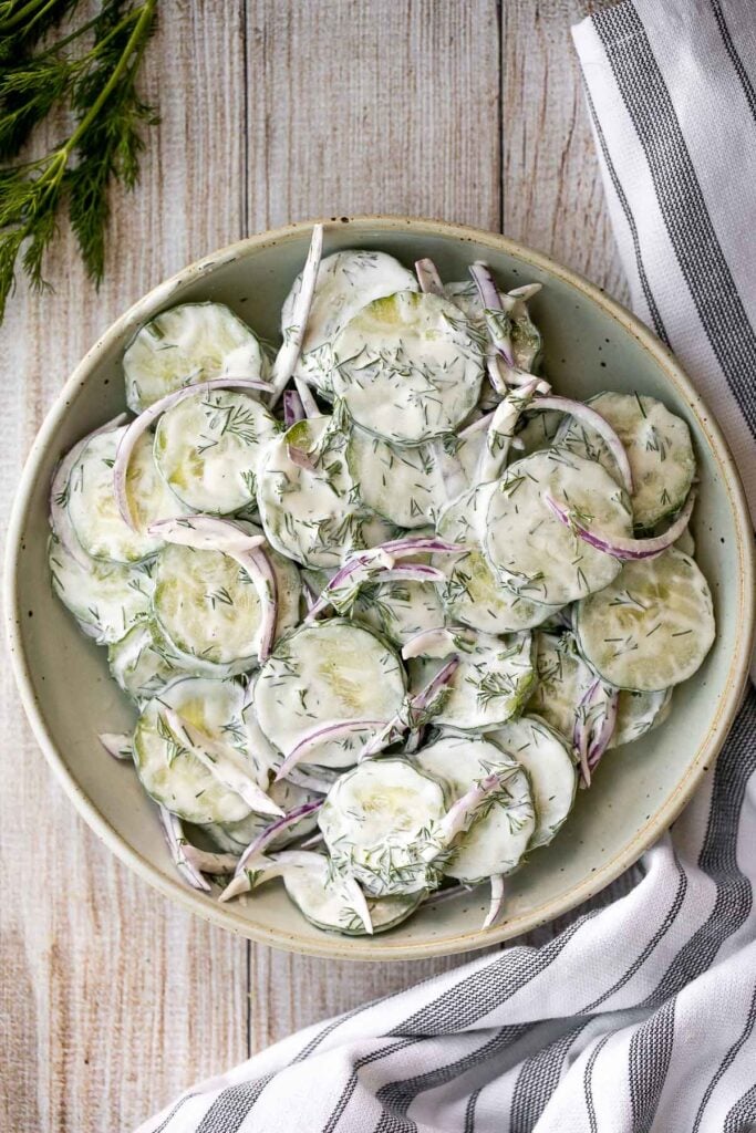 This creamy cucumber salad is the easy, refreshing snack and side dish your summer cookouts have been missing. Make it ahead with just 5 minutes prep. | aheadofthyme.com