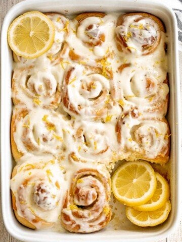 Soft and fluffy lemon sweet rolls are filled with a lemon vanilla sugar and topped with homemade lemon cream cheese icing. They're sweet, citrusy, and tart. | aheadofthyme.com