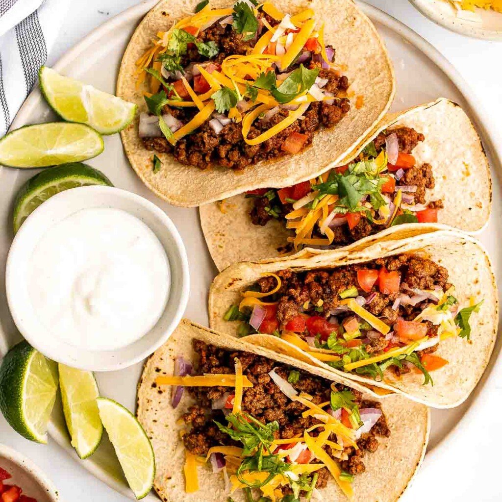 Spice up Taco Tuesday with these delicious, authentic, and easy-to-make Mexican ground beef tacos. Perfect for a quick weeknight dinner or a fiesta! | aheadofthyme.com