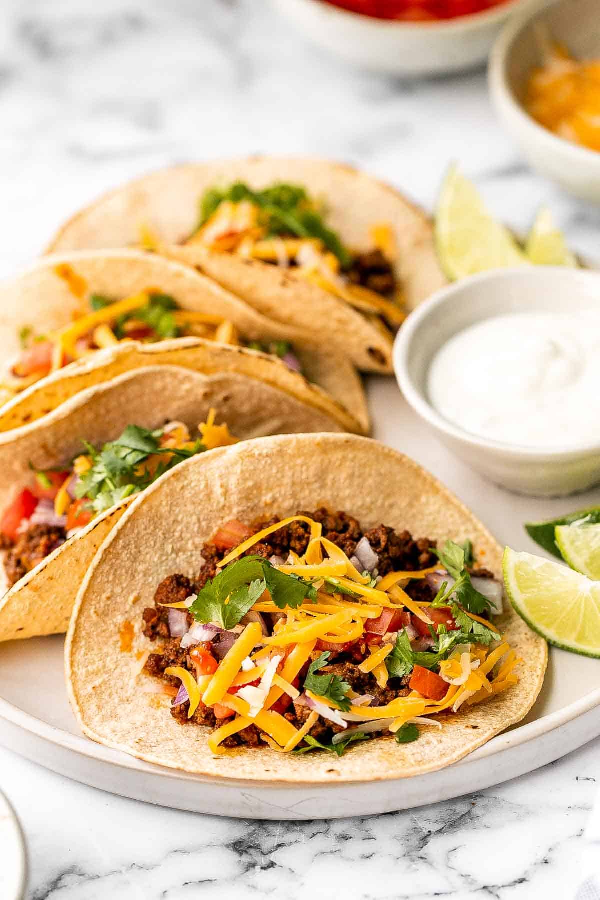 Spice up Taco Tuesday with these delicious, authentic, and easy-to-make Mexican ground beef tacos. Perfect for a quick weeknight dinner or a fiesta! | aheadofthyme.com