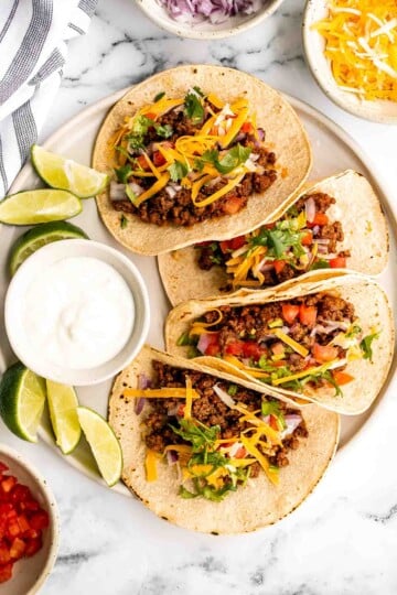 Spice up Taco Tuesday with these delicious, authentic, and easy-to-make Mexican ground beef tacos. Perfect for a quick weeknight dinner or a fiesta! | aheadofthyme.com