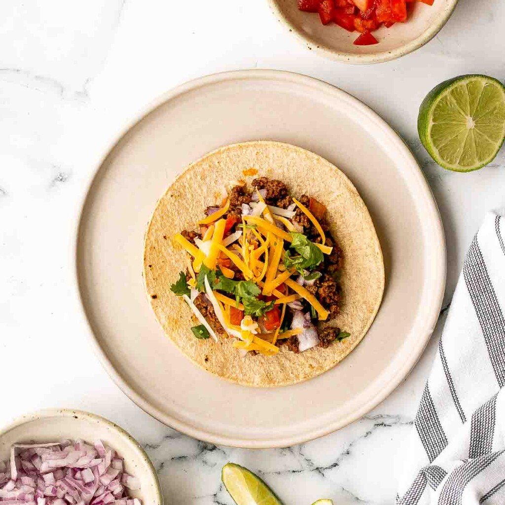 Spice up Taco Tuesday with these delicious, authentic, and easy-to-make Mexican ground beef tacos. Perfect for a quick weeknight dinner or a fiesta! | aheadofthyme.com
