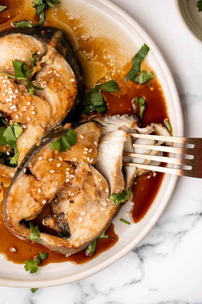 Flaky, oily, and tender, miso black cod (or sablefish) packed with delicious Asian flavours is an indulgent meal that’s as healthy as it is delicious. | aheadofthyme.com