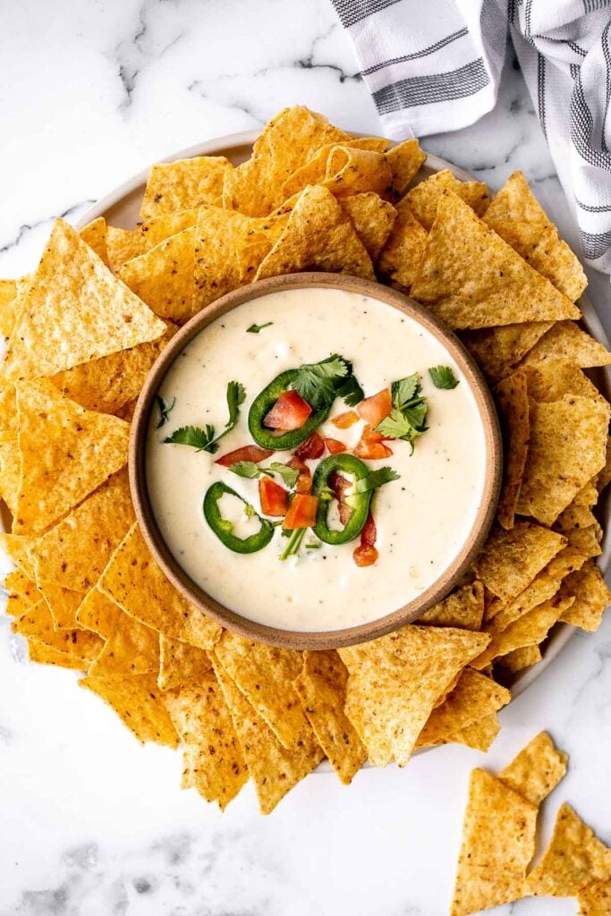 Homemade queso Mexican cheese dip is smooth, creamy, delicious, flavorful, and so easy to make. It's so much better than store-bought in every way. | aheadofthyme.com