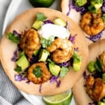 Shrimp avocado tostadas are a delicious, crunchy, quick and easy Mexican dish you can make in just 15 minutes, loaded with the best combination of toppings. | aheadofthyme.com
