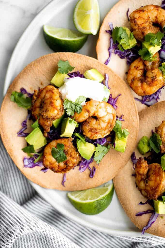 Shrimp avocado tostadas are a delicious, crunchy, quick and easy Mexican dish you can make in just 15 minutes, loaded with the best combination of toppings. | aheadofthyme.com