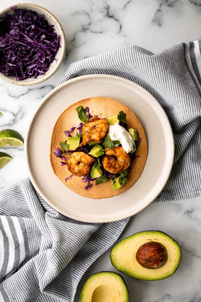 Shrimp avocado tostadas are a delicious, crunchy, quick and easy Mexican dish you can make in just 15 minutes, loaded with the best combination of toppings. | aheadofthyme.com