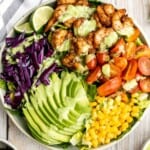Shrimp taco salad with cilantro lime dressing is flavourful, delicious, and easy to make. It has all the fixings and of shrimp tacos, but without the mess. | aheadofthyme.com