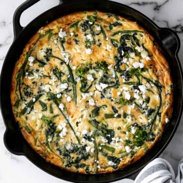 Spring vegetable frittata is a delicious breakfast or served at any time of the day. It's a one-pan meal that starts on the stove and moves to the oven. | aheadofthyme.com